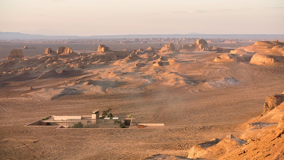 H.O.M.E.Haus 2022在沙漠中。传统的捕风塔(Badgir)矗立在地面上，像一座雄伟的雕塑